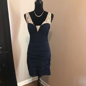 Mini dress with open back and front details!